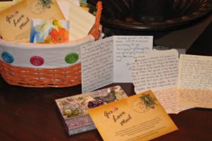 A snapshot of hand-written letters in a basket for Girls Love Mail charity